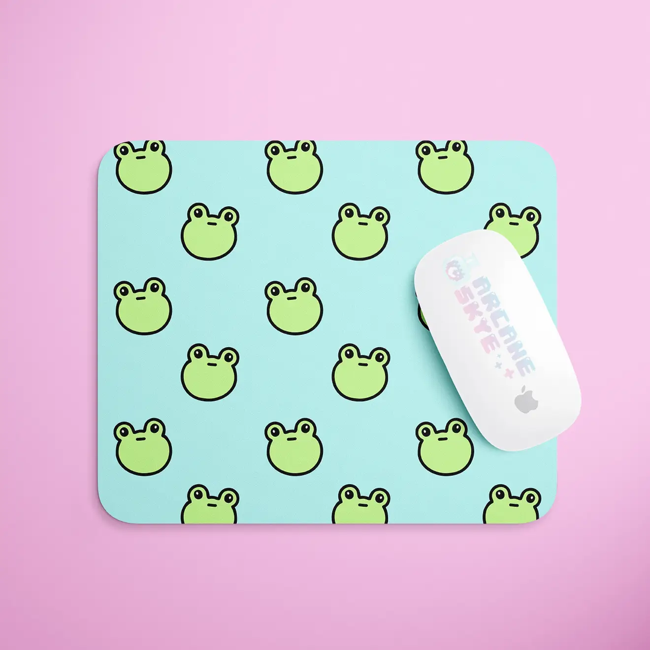 a mouse pad with a frog pattern on it