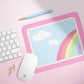 a computer mouse and keyboard on a pink surface