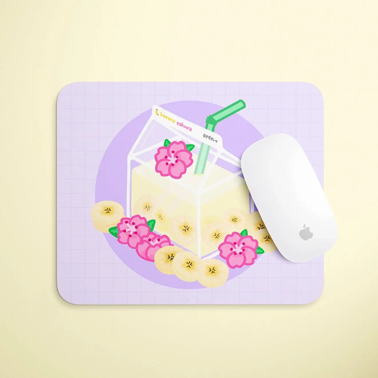 a mouse pad with a glass of milk and banana slices