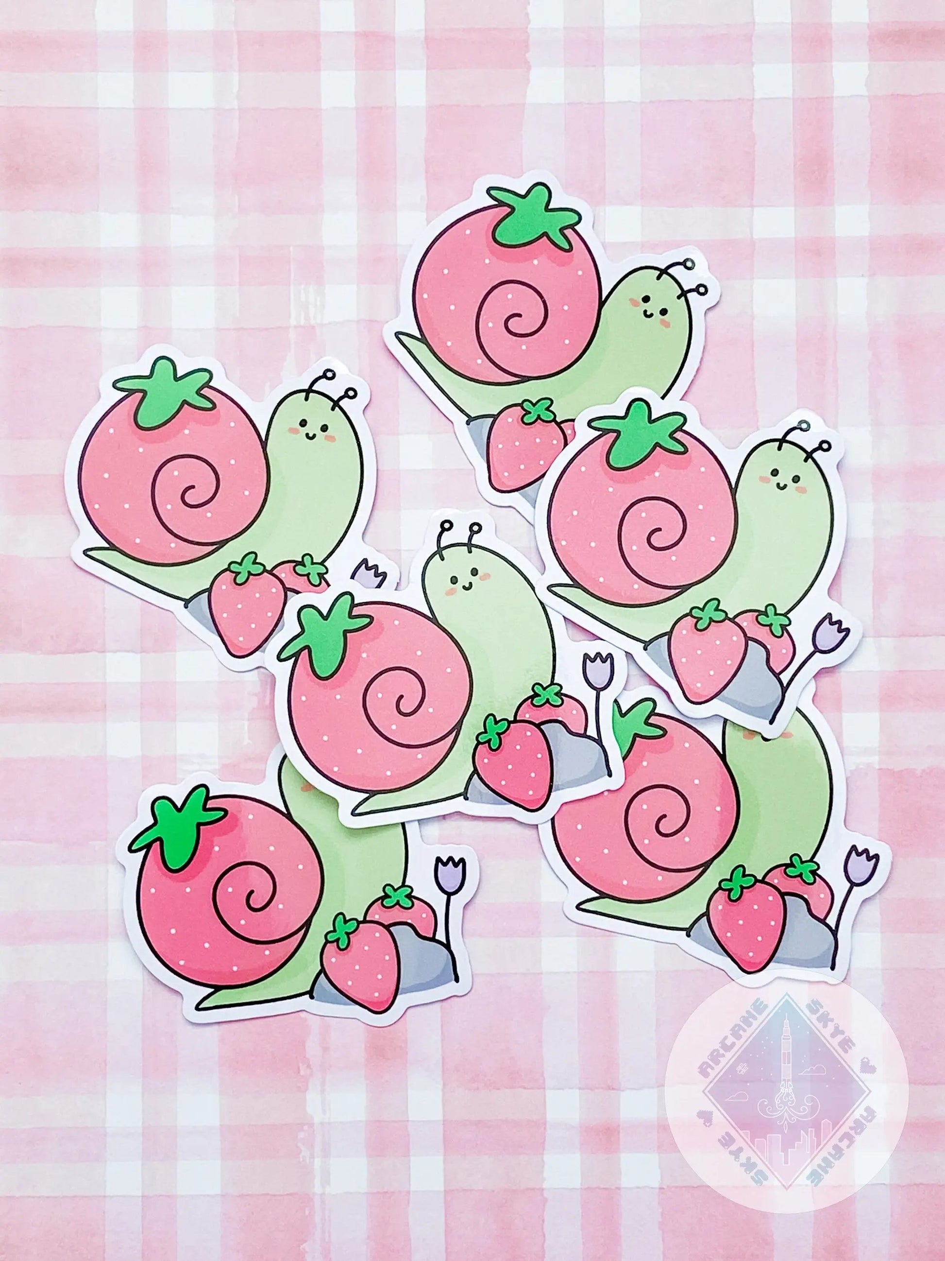 a pile of pink and green snails stickers