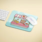 a mouse pad with a teddy bear on it