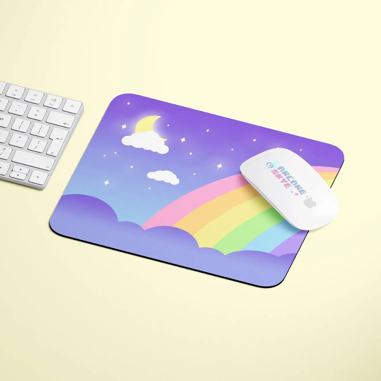a mouse pad with a rainbow and a keyboard