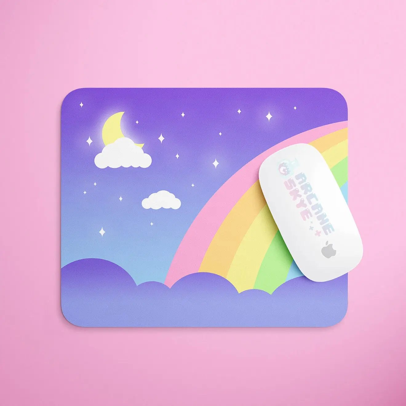 a mouse pad with a rainbow and clouds on it