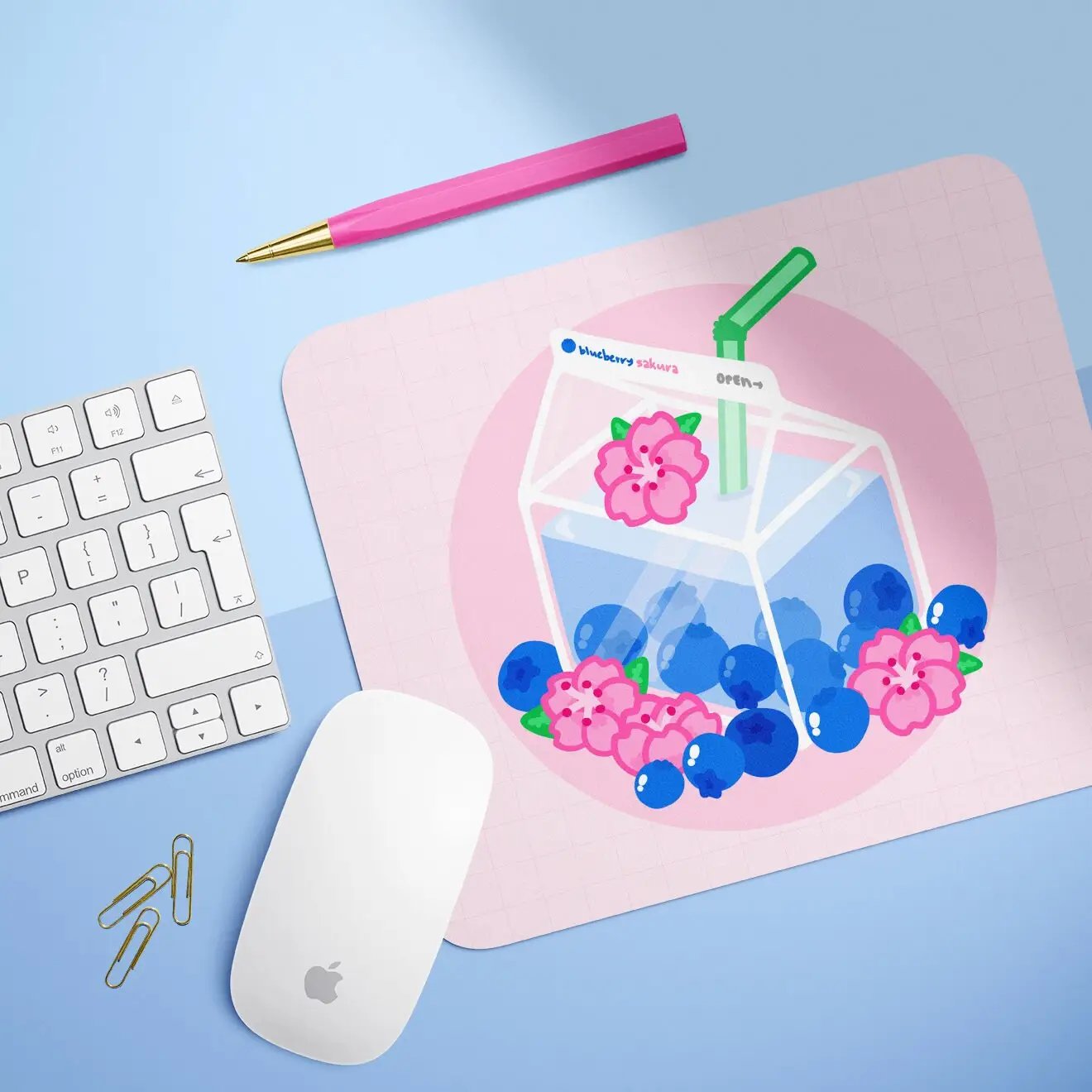 a mouse pad with a picture of a drink and blueberries on it